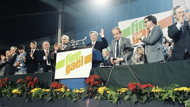 Senior party members including Peter Barry applaud taoiseach Garret FitzGerald during the Fine Gael Ard Fheis in October 1983 (Pic: RTÉ Stills Library)