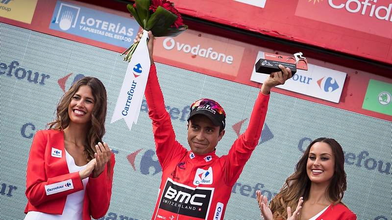 Atapuma celebrates on the podium after retaining the red jersey following the 7th stage