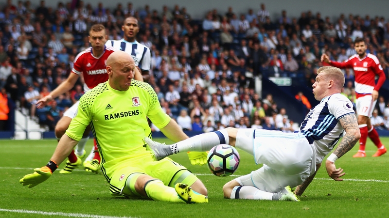 Brad Guzan saves from James McClean
