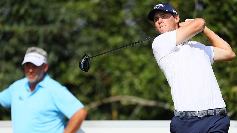 Thomas Pieters tees off on the first hole watched by Darren Clarke during Made in Denmark