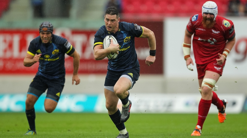 Ronan O'Mahony on his way to scoring a try for Munster in Wales