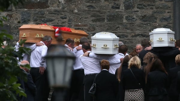 The coffins are taken into St Mary's Church in Castlerahan, Co Cavan