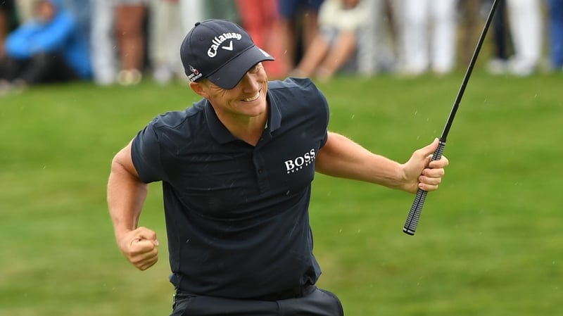 Noren pumps his fist after sinking the winning putt