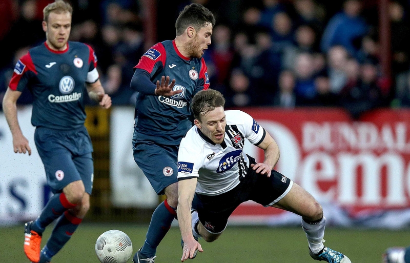 John Russell tangles with David McMillan of Dundalk at Oriel Park