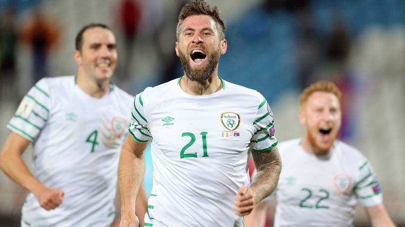 Daryl Murphy wheels away in celebration with John O'Shea (L) and Stephen Quinn