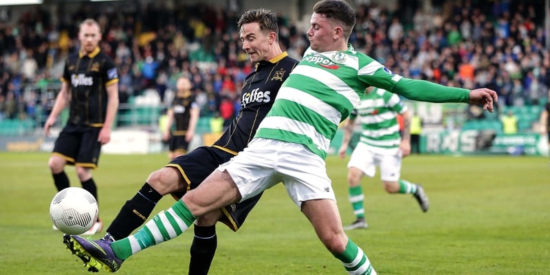 Shamrock Rovers' Dean Clarke battles Ronan Finn of Dundalk in April