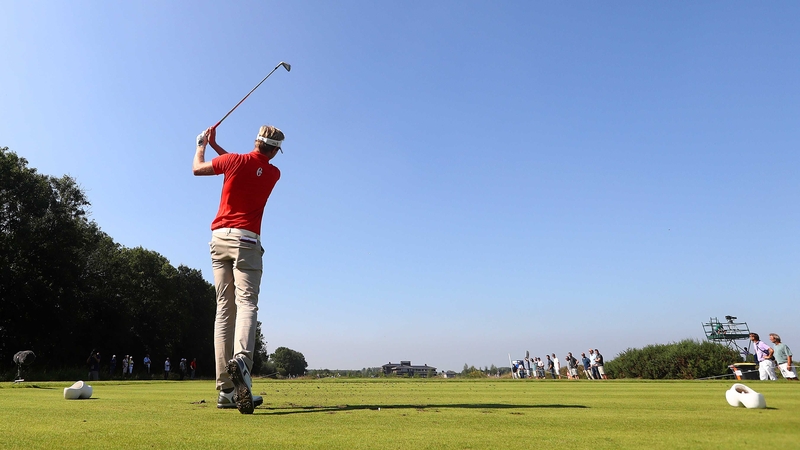 Ben Evans hits his tee shot on the seventh