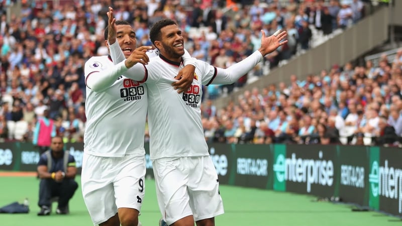 Watford's Etienne Capoue (R) celebrates scoring his side's third goal with Troy Deeney