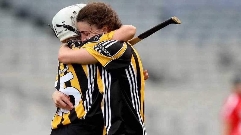 Julie Ann Malone (R) embraces Shelly Farrell at the final whistle