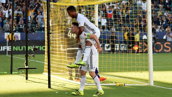 Robbie Keane celebrates his goal with Giovani dos Santos