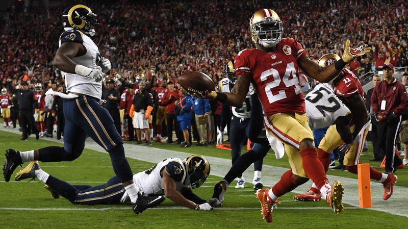 Shaun Draughn of the San Francisco 49ers scores a touchdown