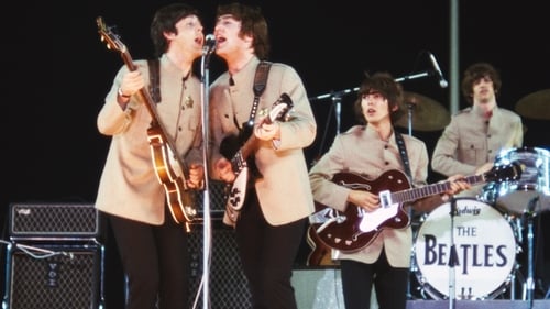 The Beatles playing at Shea Stadium