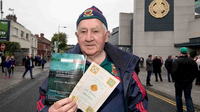 Dan Hoban from Newport in Mayo outside Croke Park with a copy of the 1951 All-Ireland final programme, which he attended, alongside today's programme