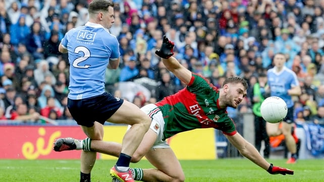 Philly McMahon and Aidan O'Shea compete for the loose ball