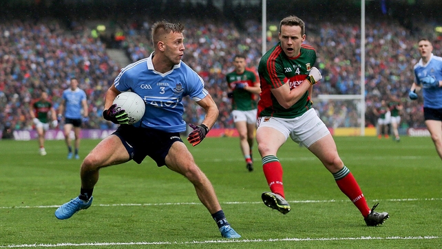 Andy Moran of Mayo prepares to go in with his shoulder on Dublin's Jonny Cooper