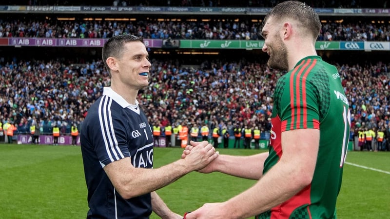 Stephen Cluxton embraces Aidan O'Shea at the final whistle