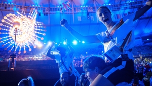 Athletes celebrate the end of the games