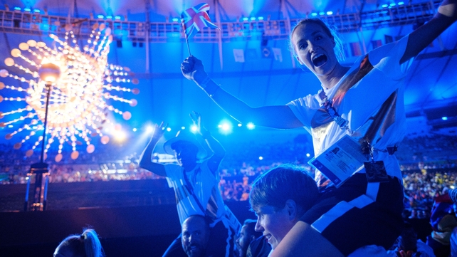 Athletes celebrate the end of the games