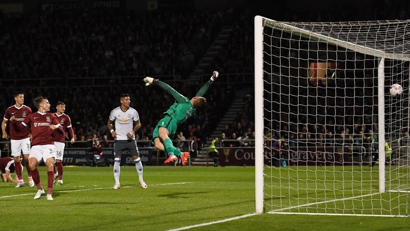 Michael Carrick's shot hits the net