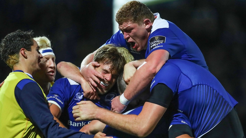 Leinster’s Jordi Murphy and Tadhg Furlong celebrate with try scorer Josh van der Flier