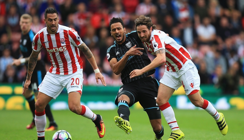 Stoke scorer Joe Allen challenges Nacer Chadli