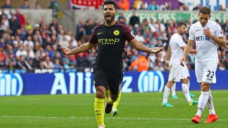 Sergio Aguero celebrates scoring from the spot at the Liberty Stadium