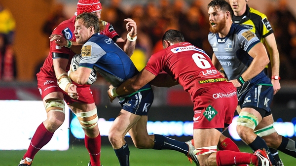Kieran Marmion of Connacht is tackled by Aaron Shingler of Scarlets