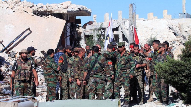 Syrian soldiers pictured after capturing Palestinian refugee camp, Handarat camp, north of Aleppo