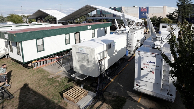 Satellite trucks and media trailers outside several hours before the debate at Hofstra University