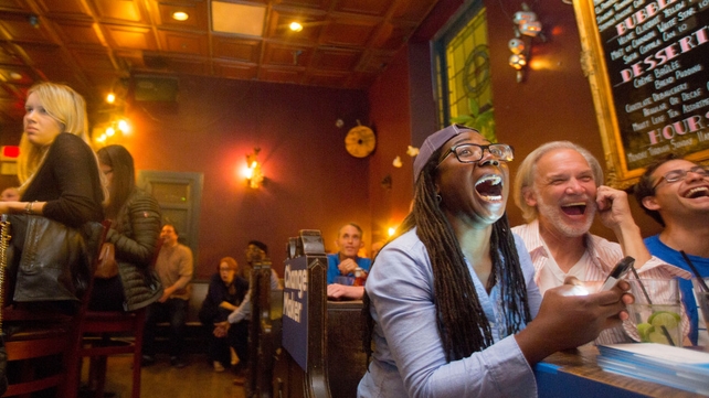 Potential voters watch the first presidential debate at a bar in Philadelphia, Pennsylvania