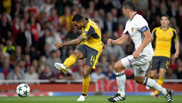 Theo Walcott scores his and Arsenal's second goal at the Emirates