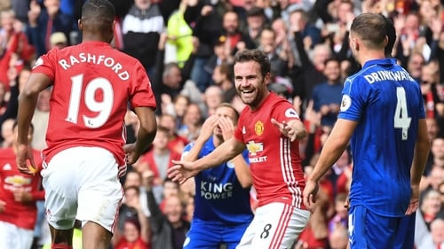 Manchester United's Spanish midfielder Juan Mata (C) celebrates after scoring against Leicester City