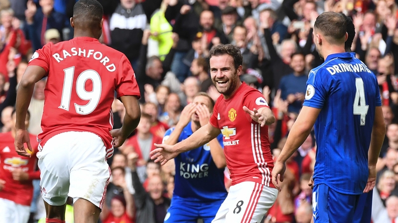 Manchester United's Spanish midfielder Juan Mata (C) celebrates after scoring against Leicester City