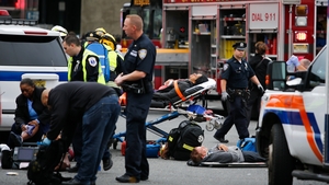 First responders treat injured passengers after the incident
