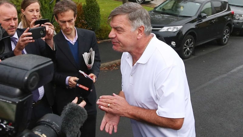 Sam Allardyce talks to reporters outside his house in Bolton following his sacking