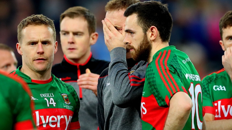 Mayo’s goalkeeper Robert Hennelly consoled by Andy Moran and Kevin McLoughlin after the game