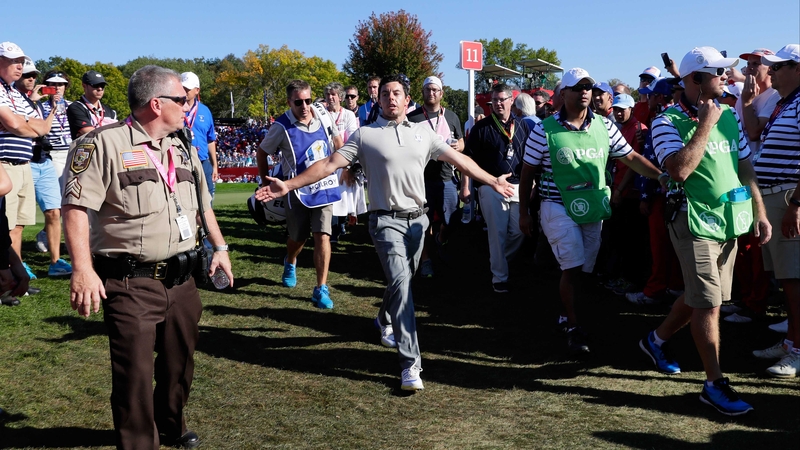 Rory McIlroy reacts following abuse on the way to the 12th