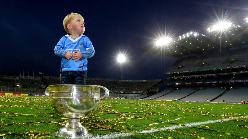 Dublin’s Denis Bastick's son Aidan with the Sam Maguire