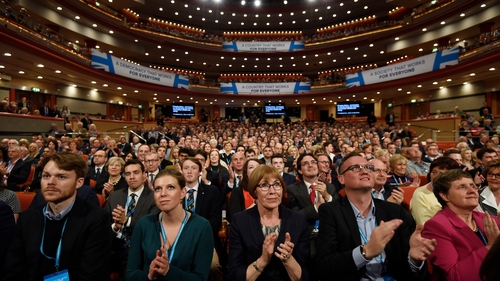 Delegates listen to a speech during the British Conservative Party conference in Birmingham