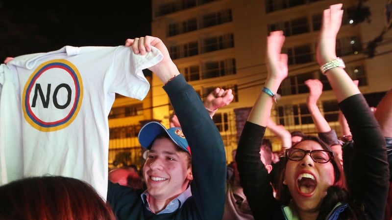 No supporters celebrate following their victory in the referendum in Bogota