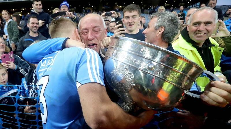 Father and son embrace after a day of trimph for Dublin