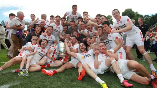 Tyrone players celebrate with the Anglo-Celt Cup