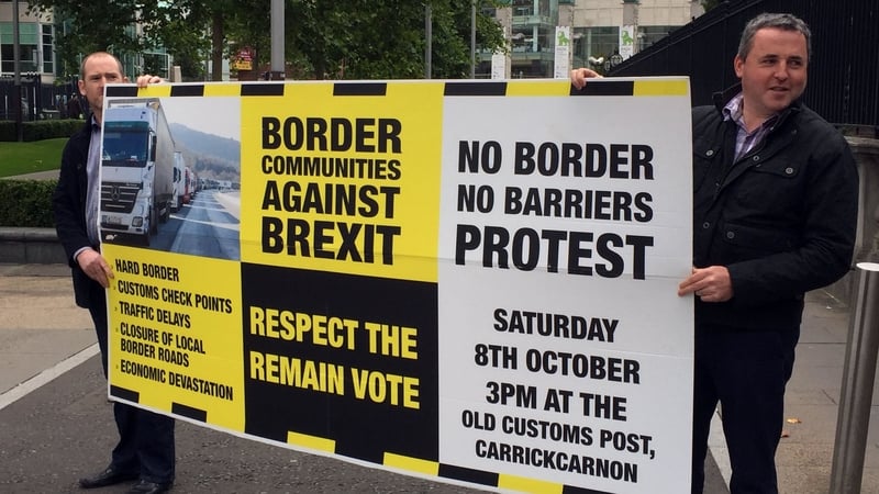 Campaigners outside Belfast's High Court where a legal challenge to Brexit is taking place