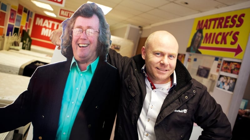 Paul Kelly (right) with a cardboard cutout of his creation