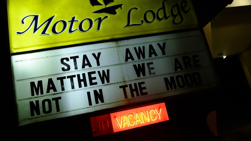 A motel displays a sign asking Hurricane Matthew to stay away in Kill Devil Hills in North Carolina as the storm makes its way towards the US