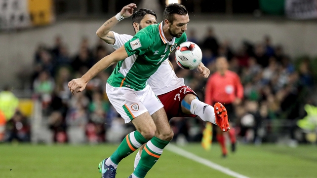 Shane Duffy tangles with Giorgi Navalovski of Georgia along the touchline