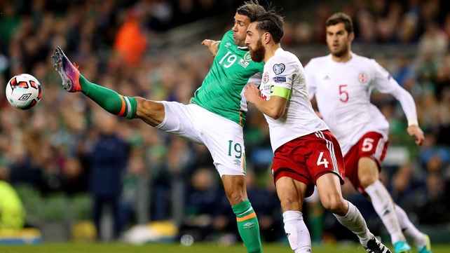 Jon Walters gets his toe to it as Guram Kashia of Georgia watches on