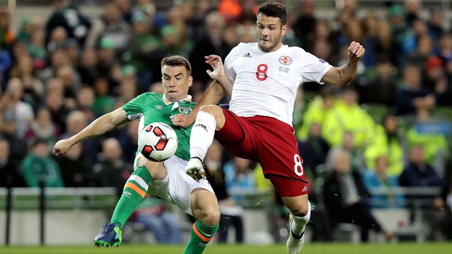 Valeri Kazaishvili of Georgia gets to the ball ahead of Ireland captain Seamus Coleman