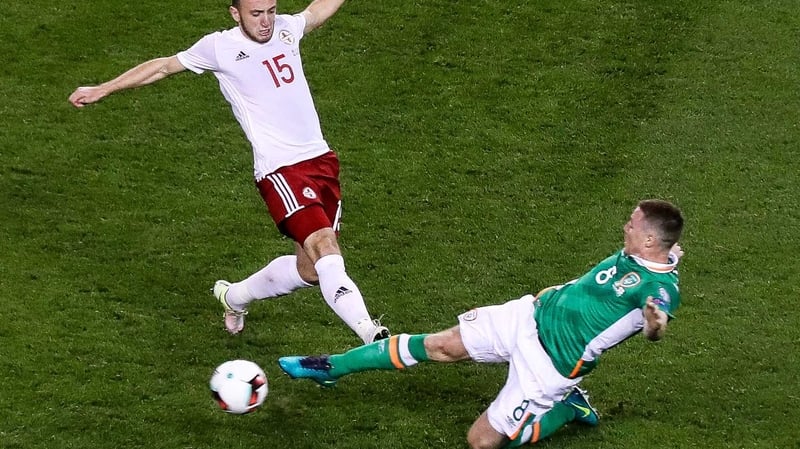 McCarthy goes in bravely for a ball against Valerian Gvilia of Georgia