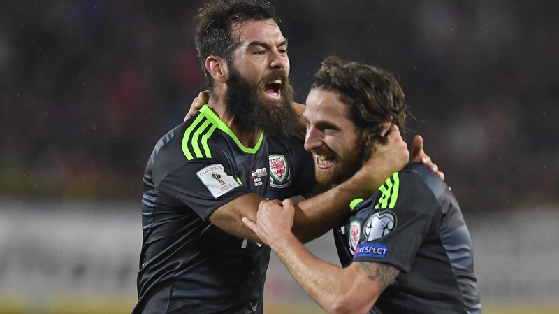 Joe Allen (R) celebrates his goal against Austria